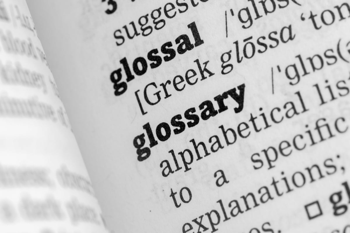 Glossary dictionary with alphabetical tabs representing comprehensive educational reference guide