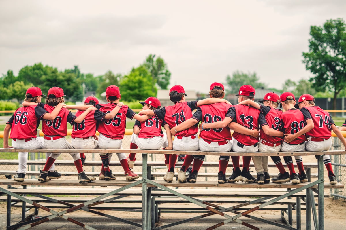 Group of baseball players standing together on the field